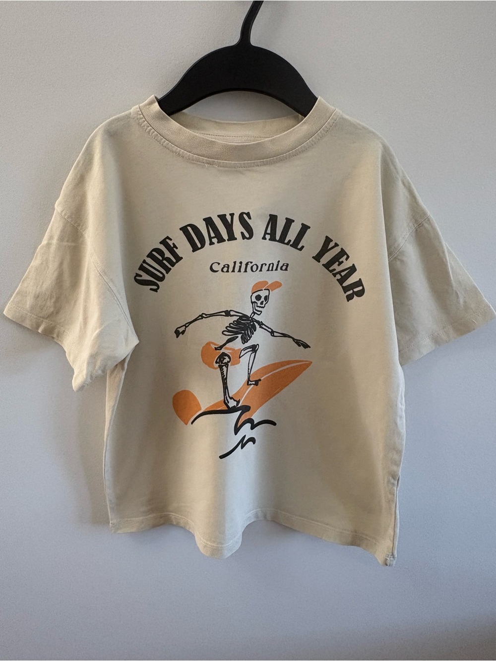 Zara Cream Tee with Orange & Black Surf Skeleton Graphic